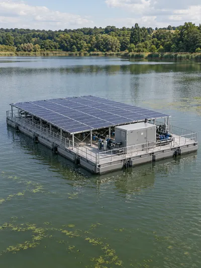 Concept illustration of a large floating treatment pontoon with a solar array and equipment deck